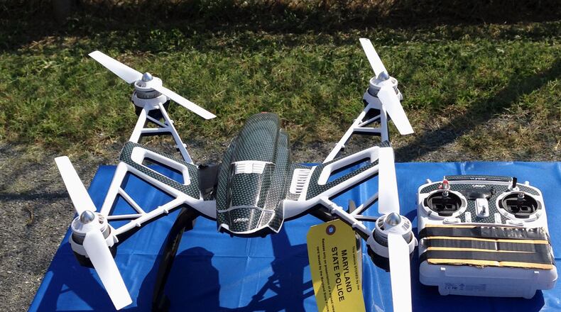 FILE - This Aug. 24, 2015, file photo shows a Yuneec Typhoon drone and controller in Jessup, Md. Maryland State Police and prison officials say two men planned to use the drone to smuggle drugs, tobacco and pornography videos into the maximum-security Western Correctional Institution near Cumberland, Md. Illinois has yet to see a case where drones have been used to illegally smuggle items into correctional facilities, according to state officials, but lawmakers are proposing legislation to penalize the activity after seeing whats happened in other states. (AP Photo/David Dishneau, File)