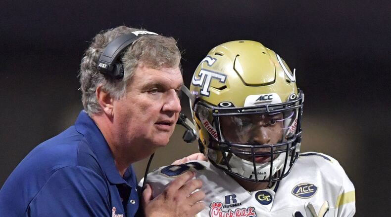 Jackets head coach Paul Johnson instructs quarterback TaQuon Marshall (16) in the first half of NCAA college football game at the Mercedes-Benz Stadium on Monday, September 4, 2017. (HYOSUB SHIN / HSHIN@AJC.COM)