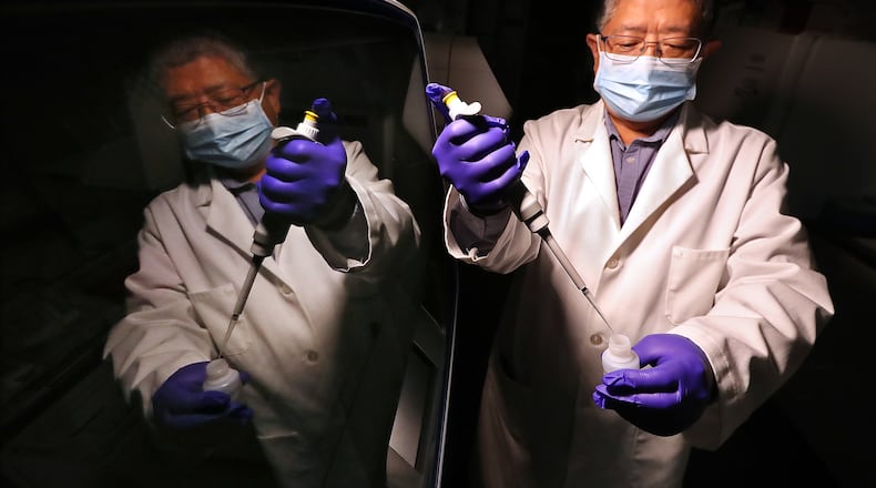 Director Jin-Xiong She works in the genomics core laboratory by a newly installed Ion Gene Studio S5 Prime Semiconductor Sequencer and an Ion Chef System at Augusta University Medical Center. The lab currently conducts genomic sequencing to study various illness, but has the capabilities to do the type of sequencing to identify variants of the virus. (Curtis Compton / Curtis.Compton@ajc.com)