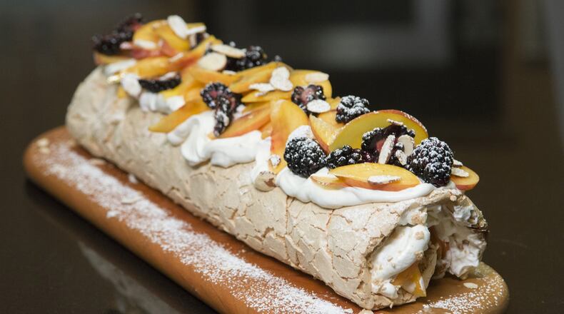 The super popular Brit-Israeli chef comes to the test kitchen with his recipe developer to make a fruit Pavlova (meringue and cream dessert) from their new cookbook. (Myung J. Chun / Los Angeles Times/TNS)