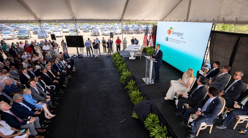 ELLABELL, GEORGIA - MAY 20, 2022:  Governor Brian P. Kemp, center right, speaks makes the announcement that South Korean automotive giant Hyundai Motor Group is building an electric vehicle plant in Ellabell, Ga. Hyundai plans to build a multi-billion-dollar electric vehicle assembly and battery plant outside of Savannah that eventually could employ about 8,100 workers. (AJC Photo/Stephen B. Morton)