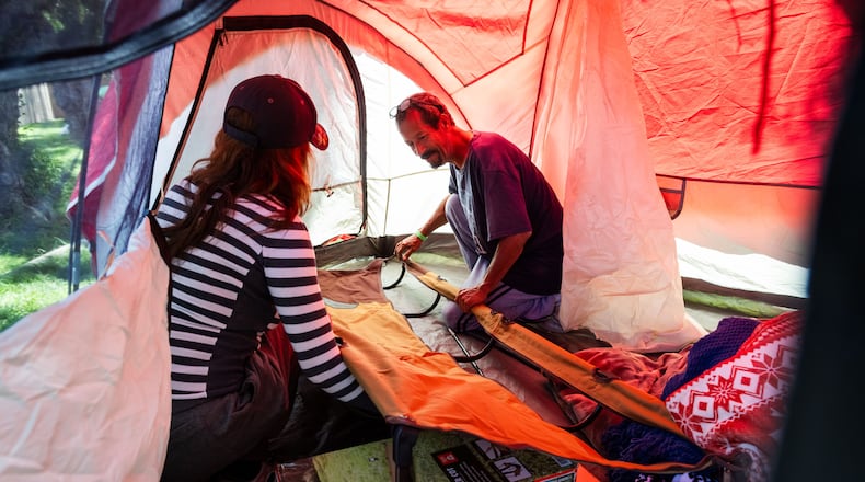 Evacuees Rodger Macias, right, and his wife Alendera Marcias set up a tent outside the Elks Lodge in Garden Grove, Calif., on Monday, May 25, 2026. (AP Photo/Ethan Swope)