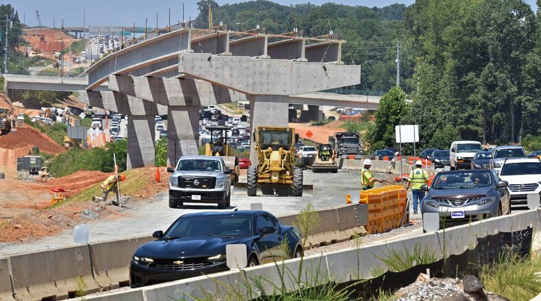 Construction work at the interchange of I-285 and Ga. 400 on Aug. 8, 2019. (Hyosub Shin / Hyosub.Shin@ajc.com)