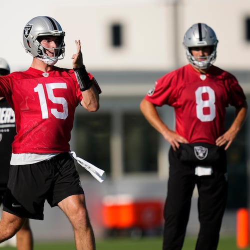 Las Vegas Raiders quarterback Fernando Mendoza (15) runs through a drill during practice at the team's NFL football training camp, Wednesday, July 29, 2026, in Henderson, Nev. (AP Photo/Lucas Peltier)
