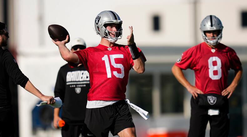 Las Vegas Raiders quarterback Fernando Mendoza (15) runs through a drill during practice at the team's NFL football training camp, Wednesday, July 29, 2026, in Henderson, Nev. (AP Photo/Lucas Peltier)