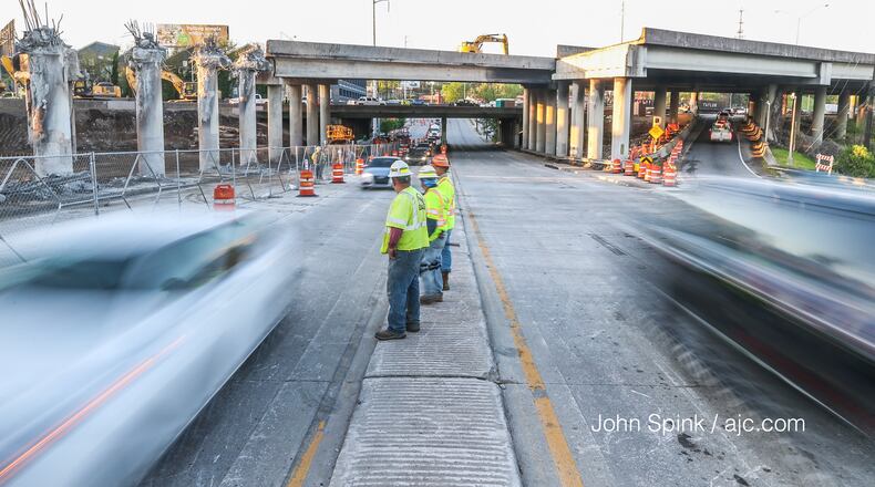 Officials reopened one northbound lane and three southbound lanes of Piedmont Road. JOHN SPINK / JSPINK@AJC.COM
