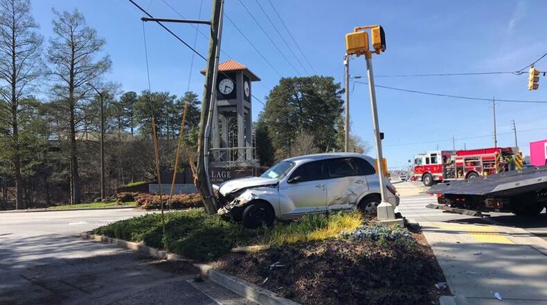 Cobb Parkway is closed in both directions near SunTrust Park after a driver slammed into a power pole, Smyrna police said.