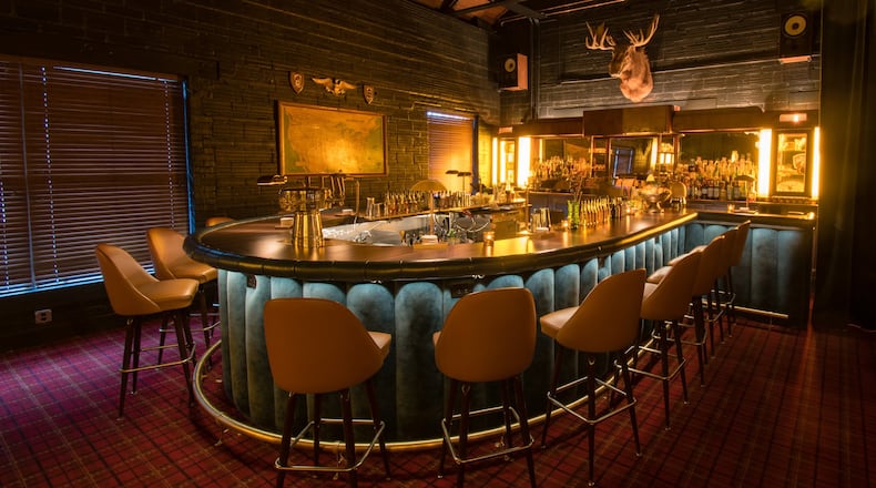 The horseshoe-shaped bar at Golden Eagle is bathed in warm light, creating an immersive experience. CONTRIBUTED BY HENRI HOLLIS