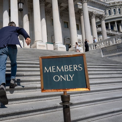 Rep. Darrell Issa, R-Calif., rushes up the steps at the Capitol for final votes before the House of Representatives leaves for a five-week recess, in Washington, Thursday, July 23, 2026. (AP Photo/J. Scott Applewhite)