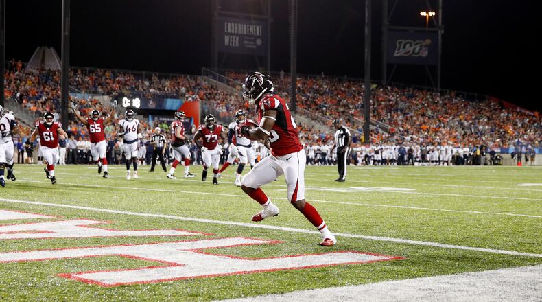 Falcons’ Brian Hill catches a one-yard touchdown pass in the second quarter  against the Denver Broncos at Tom Benson Hall Of Fame Stadium on Aug. 1, 2019 in Canton, Ohio.