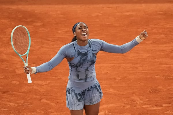 Coco Gauff celebrates after winning her quarterfinal match at the French Open in Paris.
