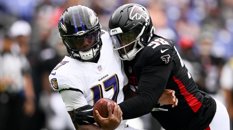 Baltimore Ravens quarterback Josh Johnson is sacked by Atlanta Falcons defensive tackle Ruke Orhorhoro during the first half of a preseason NFL football game on Saturday, Aug. 17, 2024, in Baltimore. (AP Photo/Nick Wass)
