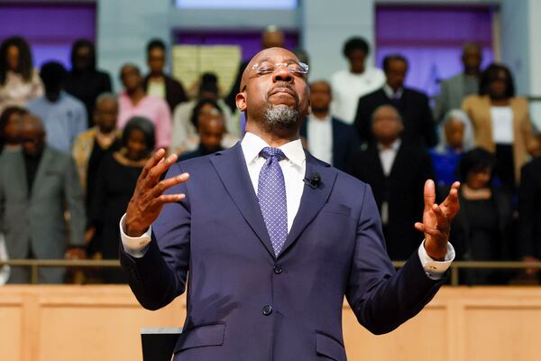At the conclusion of the town hall meeting last May, U.S. Senator Raphael Warnock, D-Ga., requested that attendees participate in a prayer at Zion Hill Baptist Church. (Miguel Martinez/AJC)