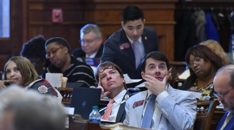 State Rep. Spencer Frye, center, and other members of the House vote on a bill Tuesday, the last day of the 2019 legislative session. HYOSUB SHIN / HSHIN@AJC.COM