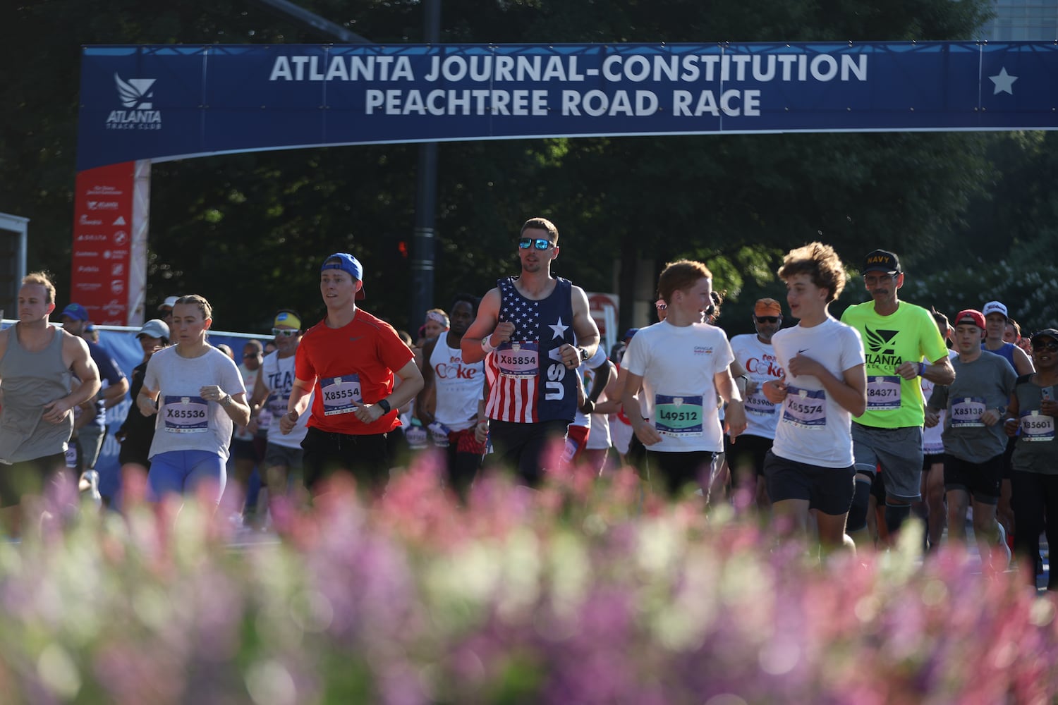 Runners take at the start of the 56th running of the Atlanta Journal-Constitution Peachtree Road Race in Atlanta on Friday, July 4, 2025.   (Arvin Temkar / AJC)
