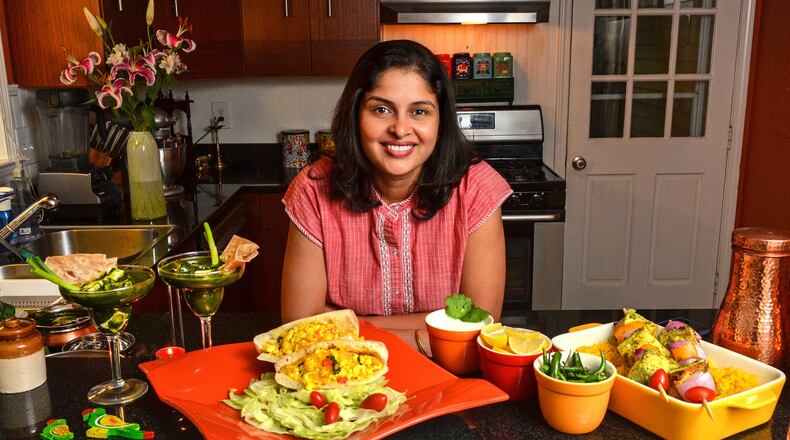 Gauri Misra-Deshpande, who grew up in Mumbai, India, makes paneer and uses that cheese in dishes such as (from left) Palak Paneer, Paneer Bhurji and Paneer Tikka Skewers. STYLING BY GAURI MISRA-DESHPANDE/ CONTRIBUTED BY CHRIS HUNT PHOTOGRAPHY