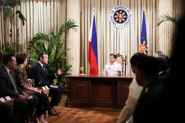 U.S. Defense Secretary Pete Hegseth, third from left, gestures as he speaks during a meeting with Philippine President Ferdinand Marcos Jr. at the Malacanang Palace in Manila, Philippines, Friday, March 28, 2025. (AP Photo/Basilio Sepe, Pool)