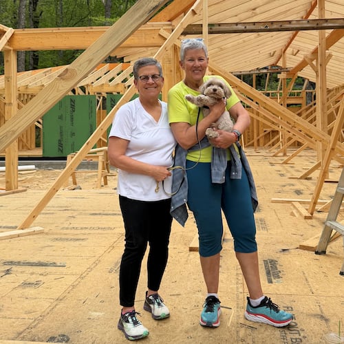 Cathy Woolard (left) and her wife, Karen Geney, pictured earlier this year at the site of the new home they are building in North Carolina. They are relocating from Atlanta after Woolard's decades in Atlanta politics and civic life. (Courtesy of Cathy Woolard)