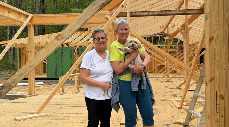 Cathy Woolard (left) and her wife, Karen Geney, pictured earlier this year at the site of the new home they are building in North Carolina. They are relocating from Atlanta after Woolard's decades in Atlanta politics and civic life. (Courtesy of Cathy Woolard)