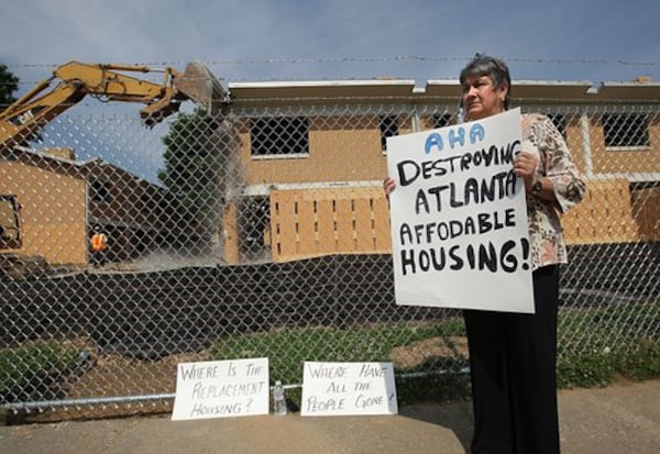 Dianne Mathiowetz stands outside Bowen Homes on Wednesday, protesting the loss of affordable housing in the city of Atlanta. (Johnny Crawford/AJC file 2009)