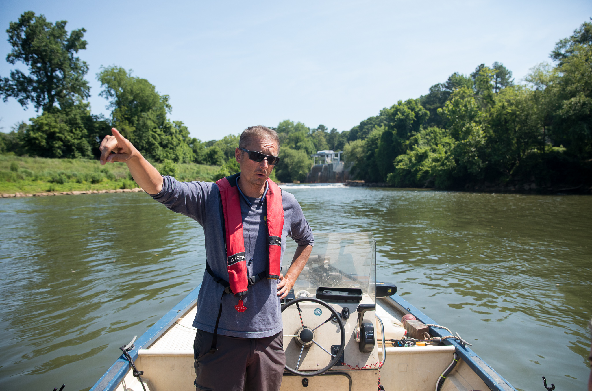 Executive Director of the Chattahoochee Riverkeeper Jason Ulseth surveys the river during a boat patrol ride with the organization on June 14, 2024. (Riley Bunch/AJC)