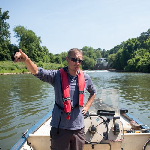 Executive Director of the Chattahoochee Riverkeeper Jason Ulseth surveys the river during a boat patrol ride with the organization on June 14, 2024. (Riley Bunch/AJC)