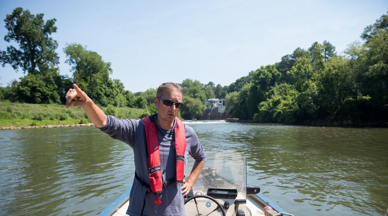 Executive Director of the Chattahoochee Riverkeeper Jason Ulseth surveys the river during a boat patrol ride on June 14, 2024. Riley Bunch/AJC