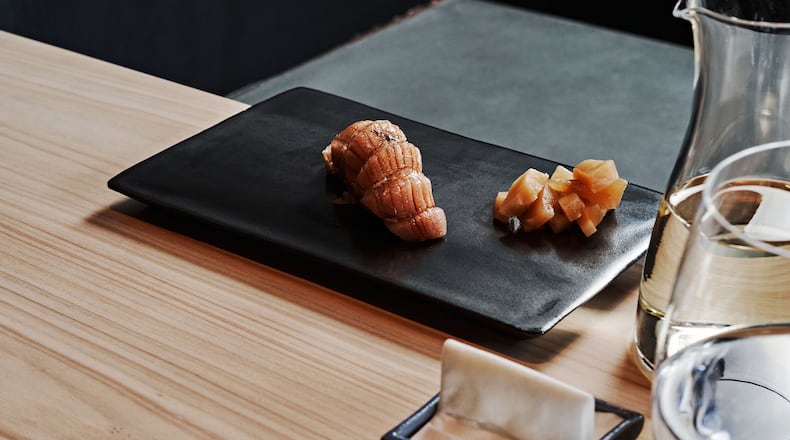 Otoro, or fatty tuna, nearly melts in your mouth at Mujo. It is shown here with cubes of palate-cleansing ginger. Courtesy of Mujo/Andrew Thomas Lee