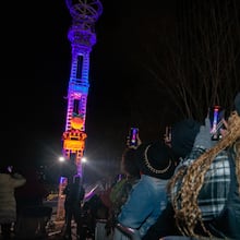 Kywanda Hammothe, right, captures the drop during the countdown to 2025. (Jenni Girtman for The Atlanta Journal-Constitution)