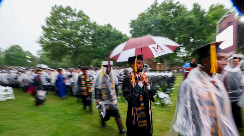 Graduates leave the ceremony as it moves indoors due to thunderstorms in the area during Morehouse College's 141st Commencement Ceremony on Sunday, May 18, 2025.
(Miguel Martinez/ AJC)