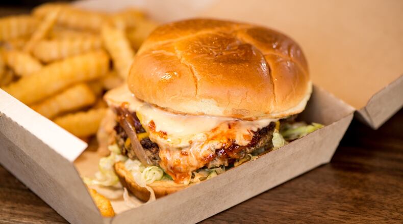 Slutty Vegan’s The Fussy Hussy is a plant-based patty with American cheese, shredded lettuce, onion, pickle and vegan mayo on a Hawaiian bun. CONTRIBUTED BY MIA YAKEL