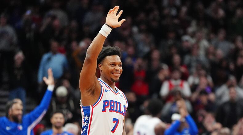 Philadelphia 76ers guard Kyle Lowry (7) acknowledges the fans as he is brought in during the final minutes of an NBA basketball game against his former team, the Toronto Raptors, in Toronto, Monday, Jan. 12, 2026. (Frank Gunn/The Canadian Press via AP)
