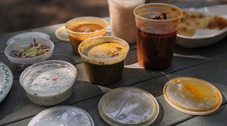 The family package for four from Chai Pani includes a choice of curry, plus dal, rice, vegetable raita, desi slaw and naan. CONTRIBUTED BY PAULA PONTES