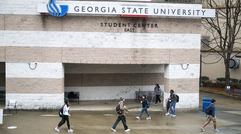 Students navigate Georgia State University’s main campus in Atlanta on March 10, 2020, in the final days before the university shifted its instruction online. One of the student organizations that’s still managing to operate is the staff of The Signal, the student newspaper. Editors and reporters have continued to cover the news during the coronavirus closures. AJC file photo ALYSSA POINTER/ALYSSA.POINTER@AJC.COM