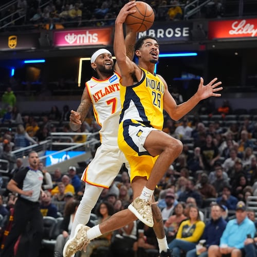 Atlanta Hawks' guard Nickeil Alexander-Walker had 21 points while Jalen Johnson added 22 points, 13 rebounds, eight assists, two steals and a block in a 128-108 win over the Pacers on Friday. (Darron Cummings/AP)