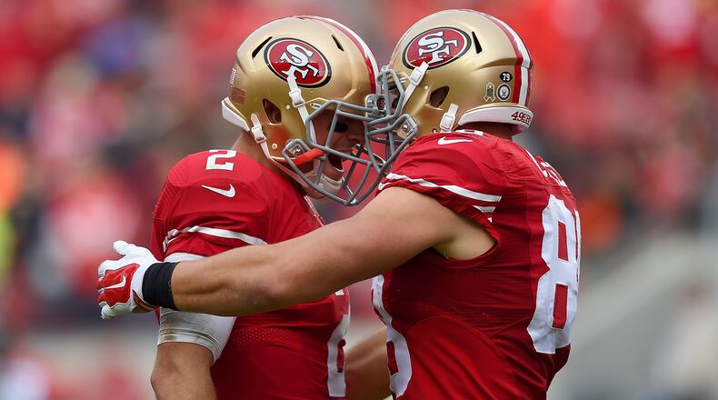 San Francisco tight end Garrett Celek and quarterback Blaine Gabbert celebrate after Celek caught his second touchdown pass against the Falcons in the second quarter Sunday at Levi's Stadium. (Getty Images)