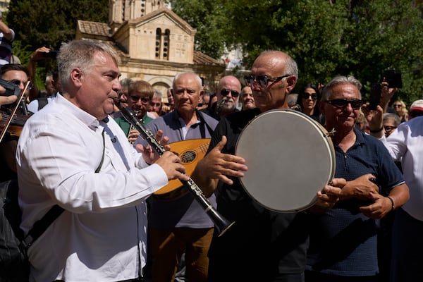 Musicians play music during a farewell ceremony for renowned clarinetist Petroloukas Chalkias, who died at 90 over the weekend, at Athens Cathedral on Wednesday, June 18, 2025. (AP Photo/Petros Giannakouris)