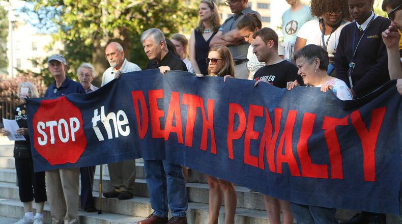 Death penalty opponents protest at the State Capitol on Tuesday, May 16, 2017, in Atlanta. Curtis Compton/ccompton@ajc.com