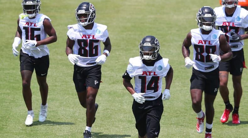 Falcons wide receivers Greg Dortch (from left), Antonio Nunn, Russell Gage and Frank Darby get in some work during organize team activities (OTAs) Tuesday, May 25, 2021, at the team training facility in Flowery Branch. (Curtis Compton / Curtis.Compton@ajc.com)