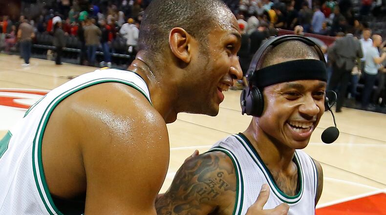 Al Horford (left) of the Boston Celtics reacts with Isaiah Thomas after their 103-101 against the Atlanta Hawks at Philips Arena on January 13, 2017 in Atlanta, Georgia. (Photo by Kevin C. Cox/Getty Images)