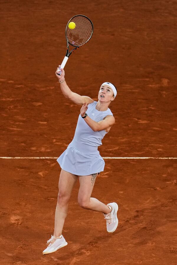 Elina Svitolina, of Ukraine, returns the ball against Aryna Sabalenka, of Belarus, during the Madrid Open tennis tournament in Madrid, Spain, Thursday, May 1, 2025. (AP Photo/Manu Fernandez)