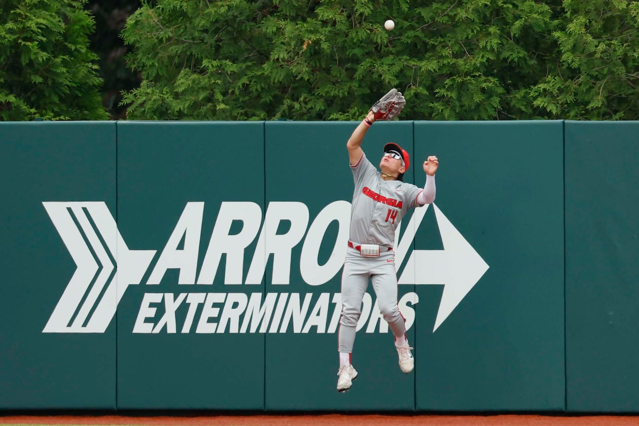Georgia Bulldog Kenny Ishikawa goes up to make a catch for an out during the third inning of their Game 2 of the NCAA Super Regional at Foley Field on Sunday, June 7, 2026, in Athens. (Miguel Martinez/AJC)