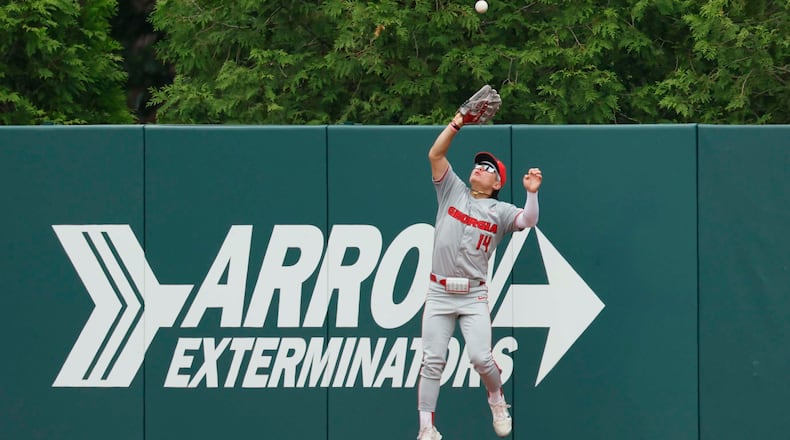 Georgia Bulldog Kenny Ishikawa goes up to make a catch for an out during the third inning of their Game 2 of the NCAA Super Regional at Foley Field on Sunday, June 7, 2026, in Athens. (Miguel Martinez/AJC)