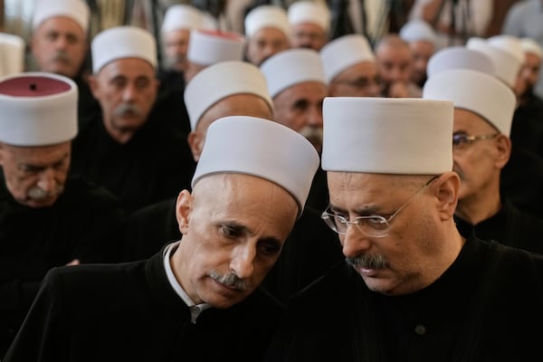 Druze clerics take part in a gathering of minority religious leaders in Beirut, Lebanon, Friday, July 18, 2025, as they speak about sectarian clashes between Druze factions, Sunni Muslim Bedouin clans, and government forces in Syria. (AP Photo/Bilal Hussein)