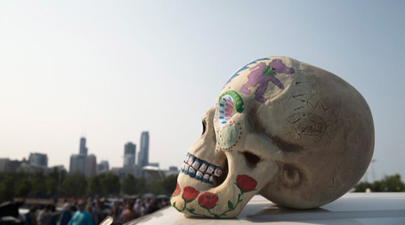 A model of a human skull sits on top of a van during a Grateful Dead concert at Soldier Field in July of 2015 in Chicago, Illinois. The colorfully, decorated skull is one of the symbols of the iconic 1970’s rock band.