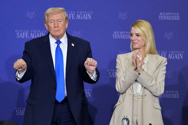 President Donald Trump and then-Attorney General Pam Bondi participate in a roundtable discussion on public safety at a Tennessee Air National Guard Base on March 23, 2026. (Bruce Newman/AP)