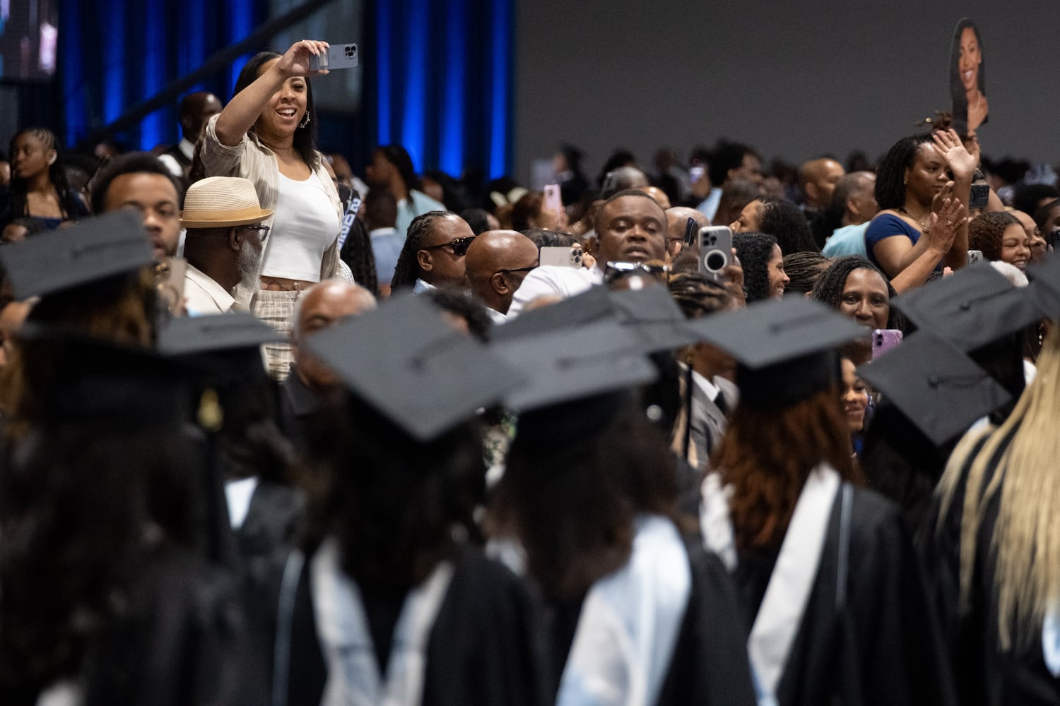 People look for their graduates during the procession at the Spelman College graduation ceremony at the Georgia International Convention Center in College Park on Sunday, May 18, 2025.   Ben Gray for the Atlanta Journal-Constitution
