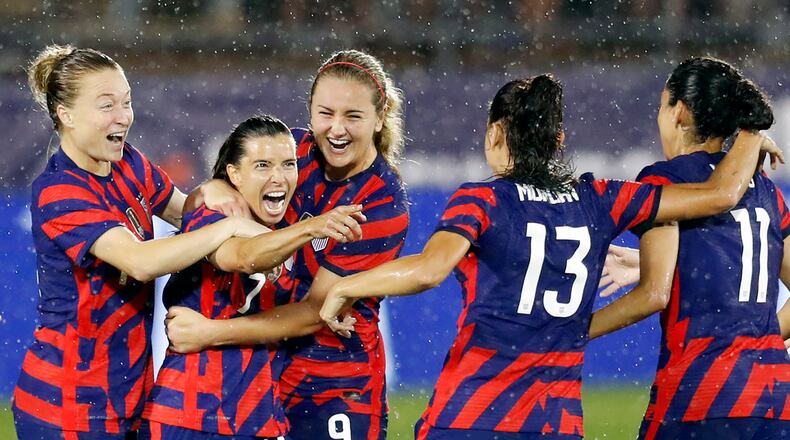 In this photo from July 1, 2021, Tobin Heath (7) of United States celebrates with Christen Press (11), Alex Morgan (13), Lindsey Horan (9) and Emily Sonnett, (14) after scoring a goal against Mexico at Rentschler Field in East Hartford, Connecticut. (Maddie Meyer/Getty Images/TNS)