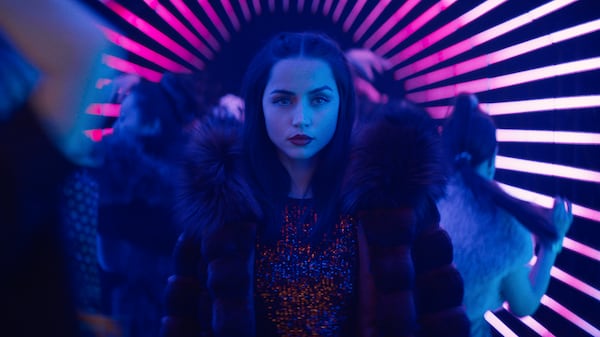 This image released by Lionsgate shows Ana de Armas in a scene from "Ballerina." (Murray Close/Lionsgate via AP)