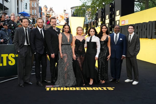 Lewis Pullman, from left, Wyatt Russell, David Harbour, Hannah John-Kamen, Florence Pugh, Julia Louis-Dreyfus, Geraldine Viswanathan, Wendell Pierce, and Jake Schreier pose for photographers upon arrival at a screening of the film 'Thunderbolts' on Tuesday, April 22, 2025, in London. (Photo by Scott A Garfitt/Invision/AP)